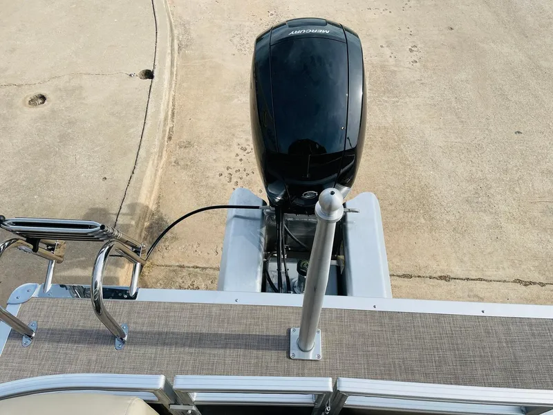 Slide: The Image of 2025 Sun Tracker Party Barge 22 RF DLX with outboard motor, docked. - 39