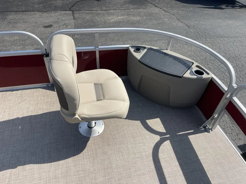 Slide: The Image of 2025 Sun Tracker Bass Buggy 18 DLX pontoon boat with beige seating and fishing station. - 8