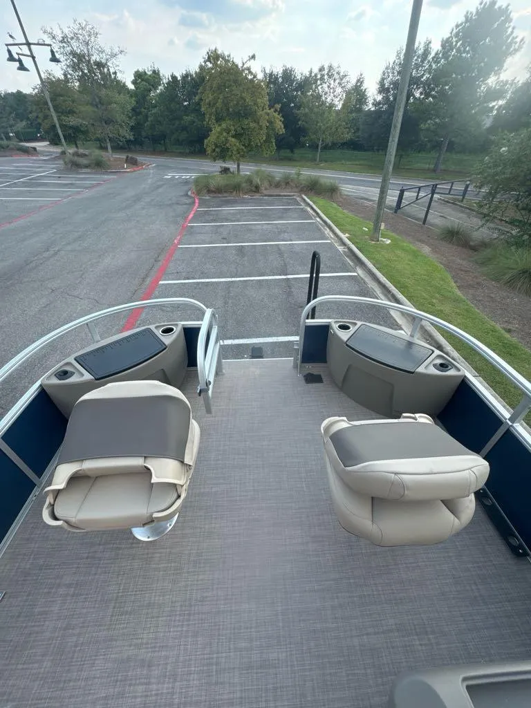Slide: The Image of 2025 Sun Tracker Bass Buggy 18 DLX pontoon boat interior with seating. - 4