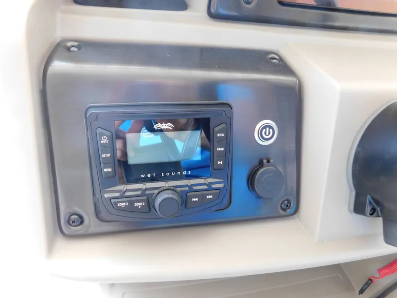 Slide: The Image of Control panel of 2025 Sun Tracker Fishin' Barge 22 DLX with Wet Sounds audio system. - 15