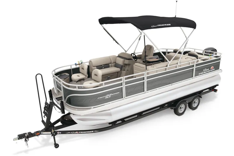 Slide: The Image of 2025 Sun Tracker Fishin' Barge 22 DLX pontoon boat on trailer, side view. - 22