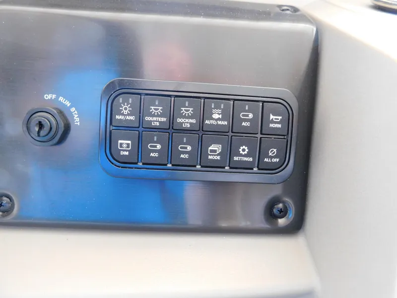 Slide: The Image of Control panel of 2025 Sun Tracker Fishin' Barge 22 DLX boat. - 31