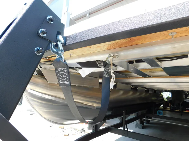 Slide: The Image of 2025 Sun Tracker Fishin' Barge 22 DLX pontoon boat underside with secure strap attachment. - 35