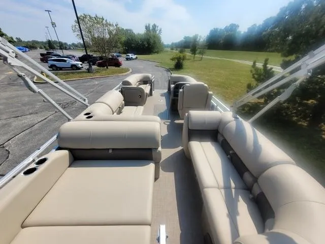 Slide: The Image of 2025 Sun Tracker Party Barge 22 RF XP3 with spacious seating and scenic park view. - 4