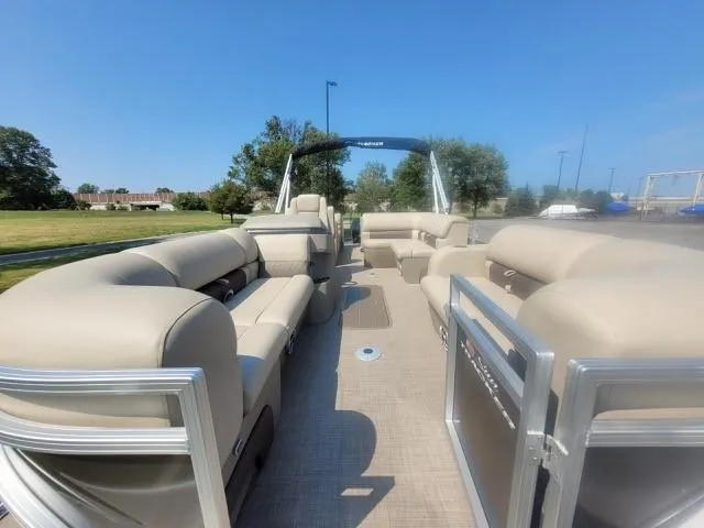Slide: The Image of 2025 Sun Tracker Party Barge 22 RF XP3 interior with beige seating and open deck. - 5