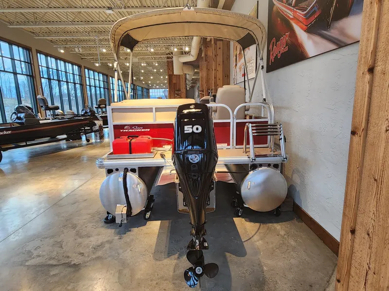 Slide: The Image of 2025 Sun Tracker Bass Buggy 16 XL Select pontoon boat in showroom. - 5