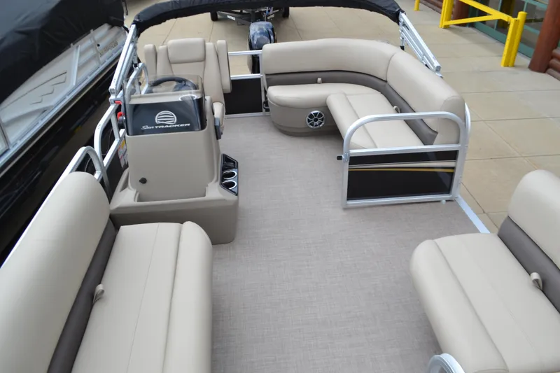 Slide: The Image of 2025 Sun Tracker Party Barge 16 DLX pontoon boat with spacious seating and modern design. - 2