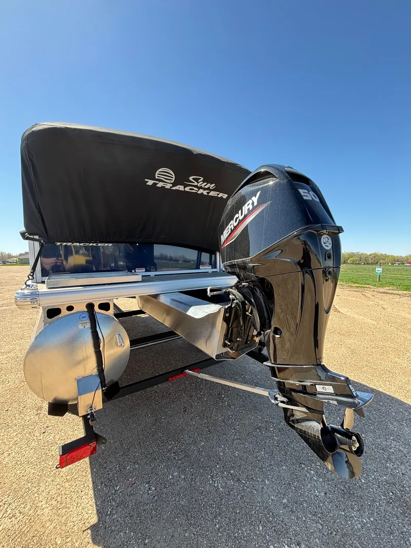Slide: The Image of 2025 Sun Tracker Bass Buggy 16 XL Select with Mercury outboard motor, rear view. - 10