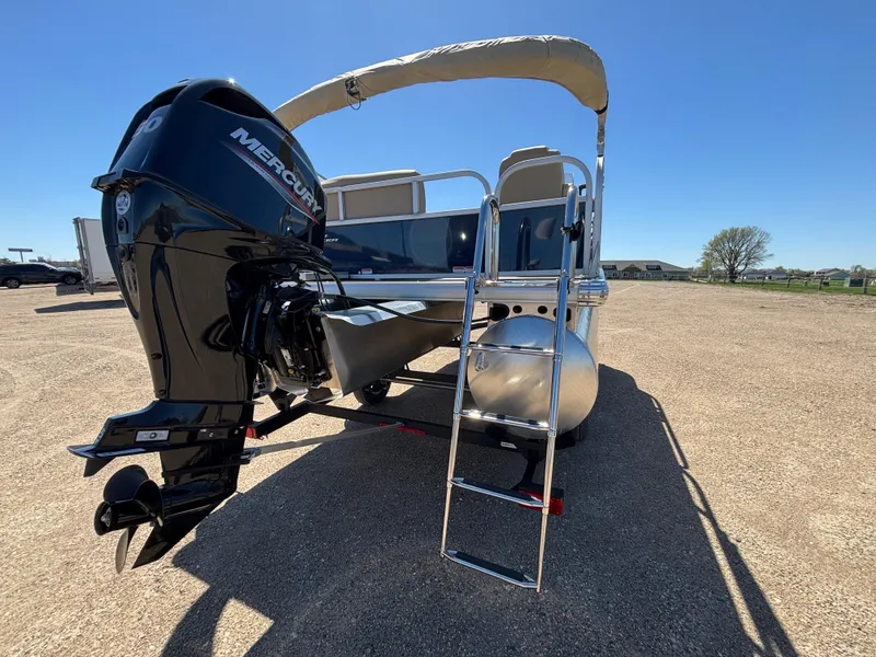 Slide: The Image of 2025 Sun Tracker Bass Buggy 16 XL Select pontoon boat with Mercury outboard motor. - 4