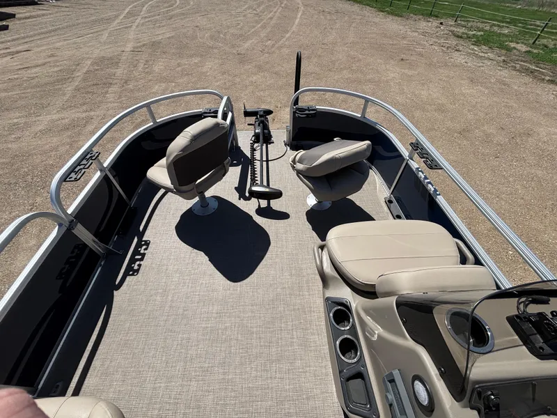 Slide: The Image of 2025 Sun Tracker Bass Buggy 16 XL Select pontoon boat interior with seating and controls. - 6
