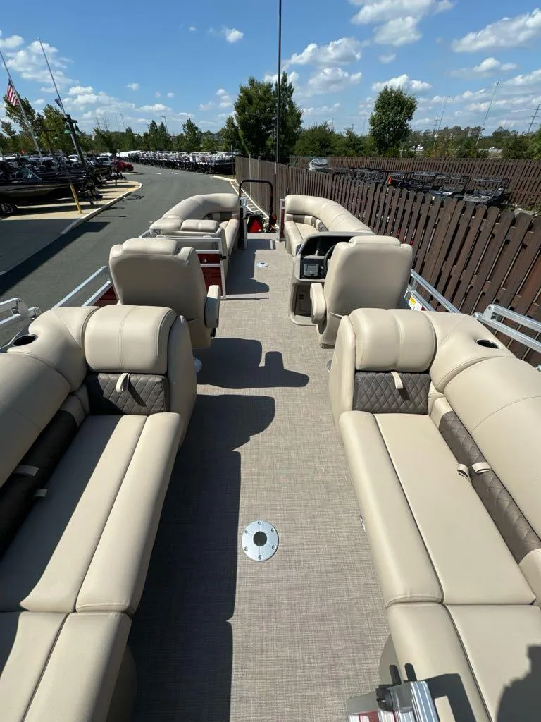 Slide: The Image of 2025 Sun Tracker Party Barge 24 DLX with spacious seating and modern design. - 2