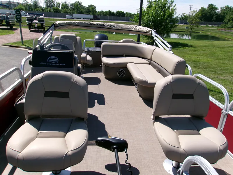 Slide: The Image of 2025 Sun Tracker Bass Buggy 18 DLX pontoon boat with spacious seating and modern design. - 3