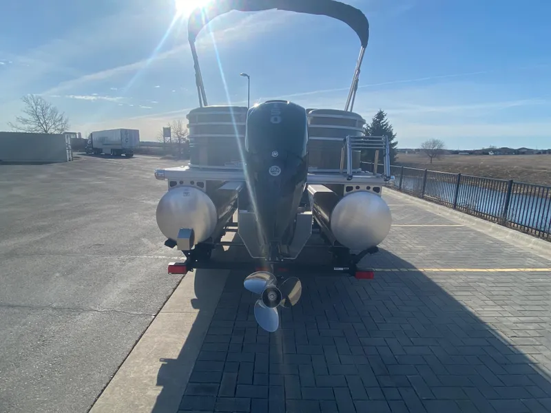 Slide: The Image of 2025 Sun Tracker Party Barge 22 XP3 pontoon boat parked on a sunny day. - 3