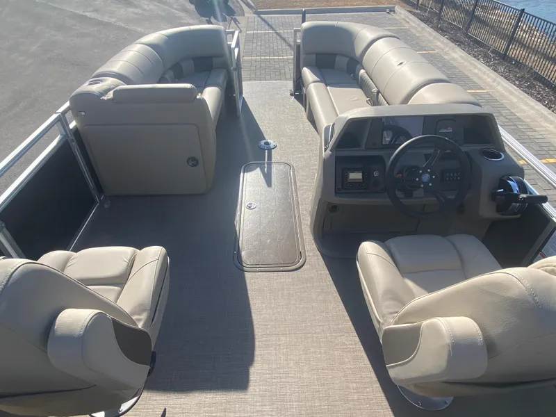 Slide: The Image of 2025 Sun Tracker Party Barge 22 XP3 interior with plush seating and modern helm. - 4