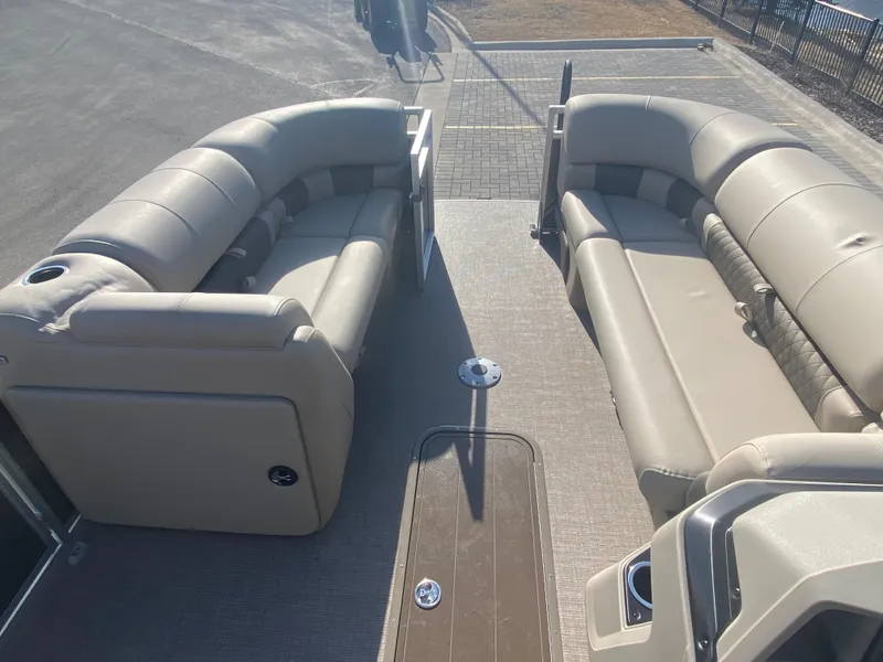 Slide: The Image of 2025 Sun Tracker Party Barge 22 XP3 interior with beige seating and spacious layout. - 7