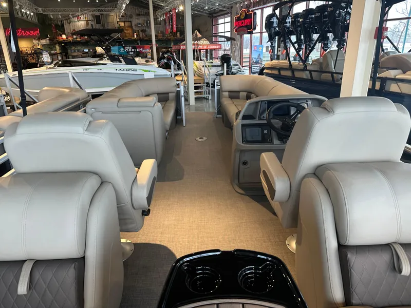 Slide: The Image of Interior of 2025 Sun Tracker Party Barge 24 DLX pontoon boat with plush seating. - 2