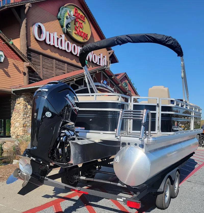 Slide: The Image of 2025 Sun Tracker SportFish 20 DLX pontoon boat at Bass Pro Shops Outdoor World. - 2