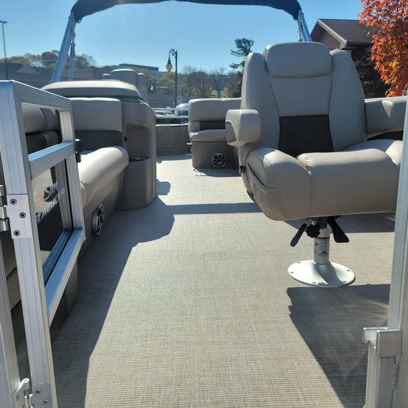 Slide: The Image of 2025 Sun Tracker SportFish 20 DLX pontoon boat interior with comfortable seating. - 3