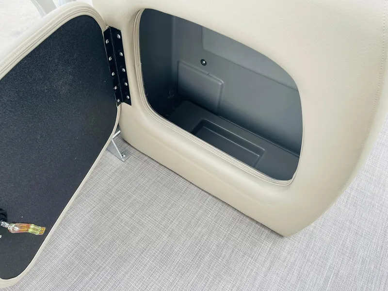 Slide: The Image of Open storage compartment on 2025 Sun Tracker Party Barge 18 DLX boat. - 17