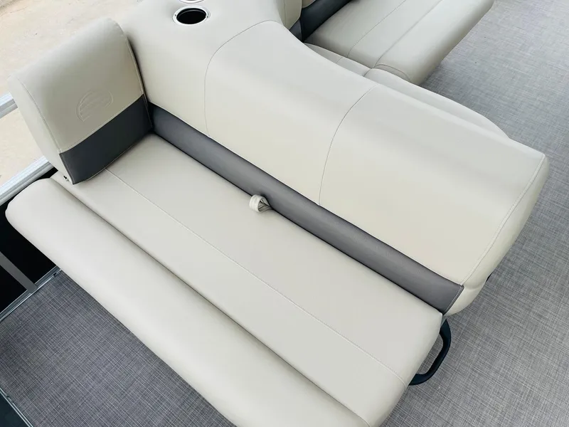Slide: The Image of Sun Tracker Party Barge 18 DLX 2025, beige seating with cup holder, gray flooring. - 27