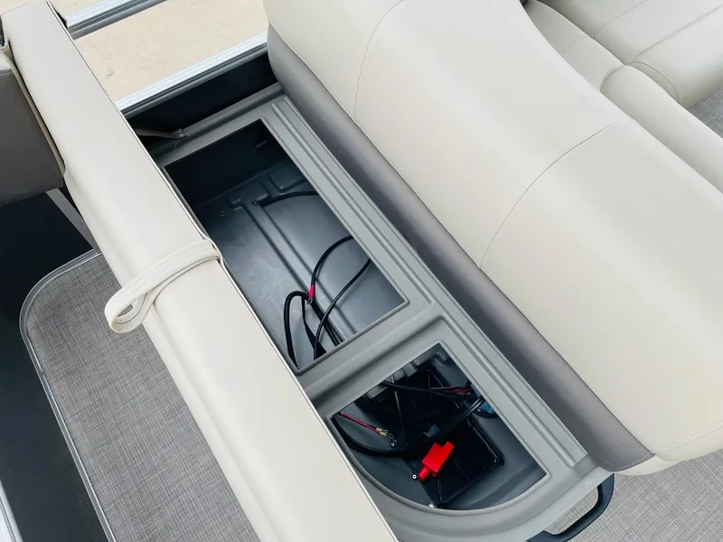 Slide: The Image of Sun Tracker Party Barge 18 DLX 2025 storage compartment with wiring. - 28