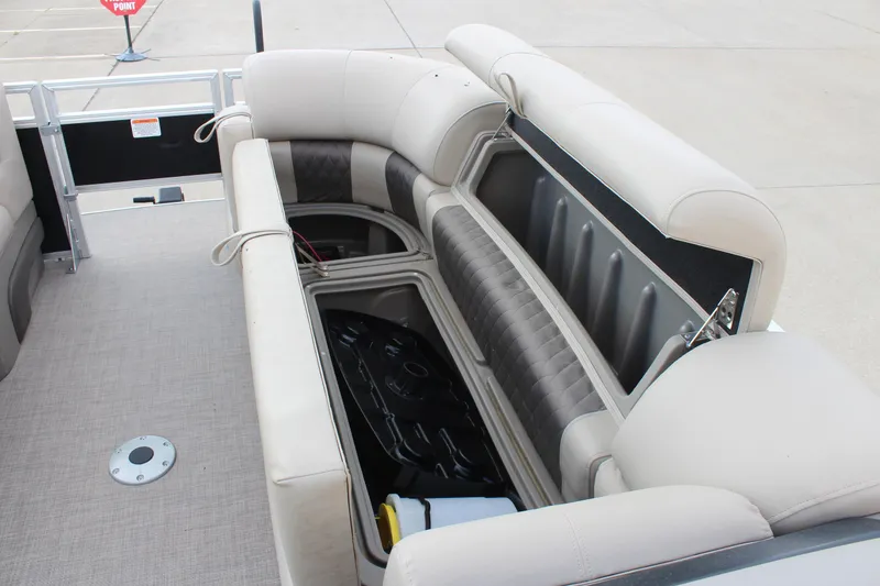 Slide: The Image of 2025 Sun Tracker SportFish 22 DLX boat interior with open storage compartments. - 14