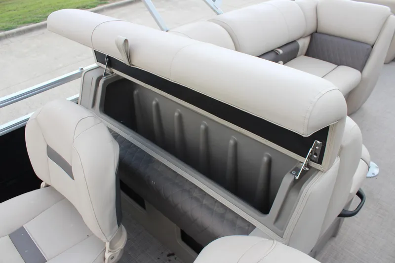 Slide: The Image of 2025 Sun Tracker SportFish 22 DLX boat interior with open storage compartment and seating. - 20