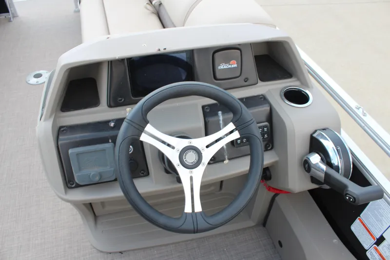 Slide: The Image of 2025 Sun Tracker SportFish 22 DLX steering console with modern controls and sleek design. - 4