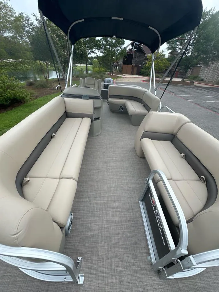 Slide: The Image of 2025 Sun Tracker Party Barge 18 DLX with spacious seating and canopy. - 4