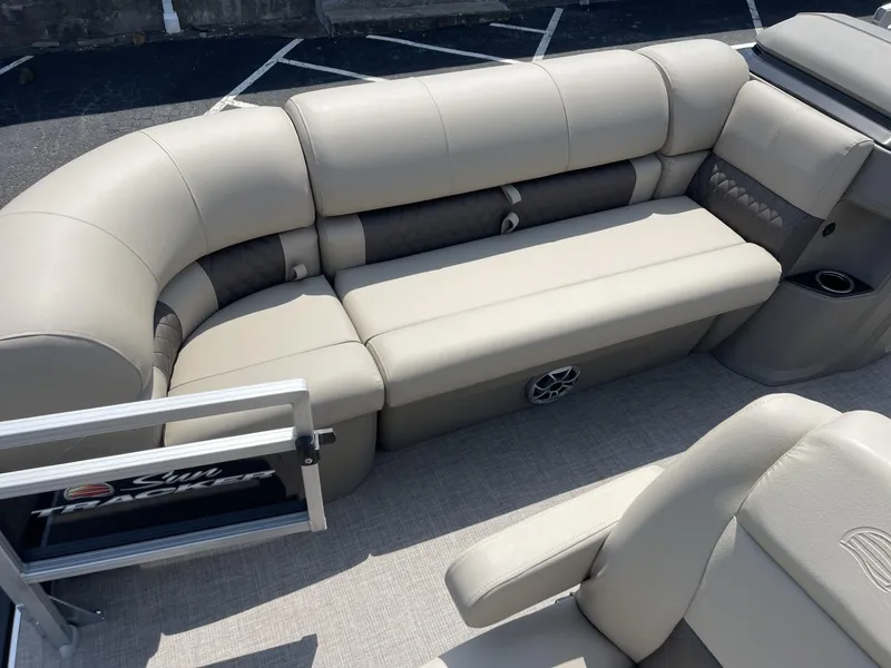 Slide: The Image of 2025 Sun Tracker SportFish 20 DLX pontoon boat interior with beige seating. - 6