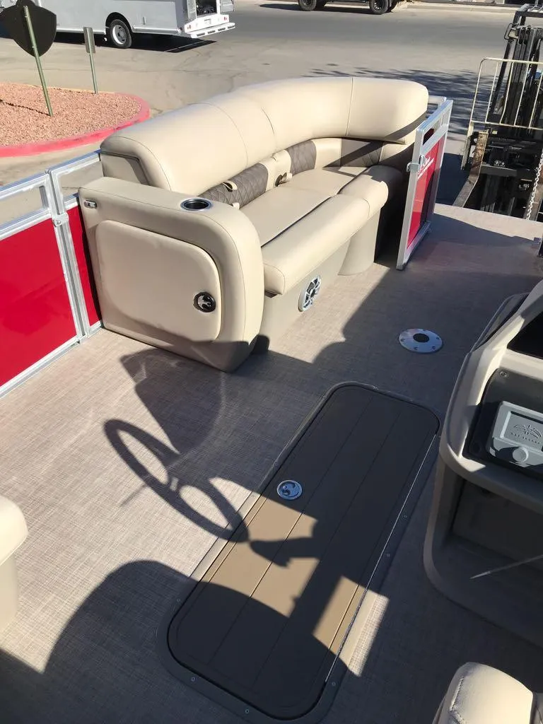 Slide: The Image of 2025 Sun Tracker Party Barge 22 RF XP3 with beige seating and red accents. - 10