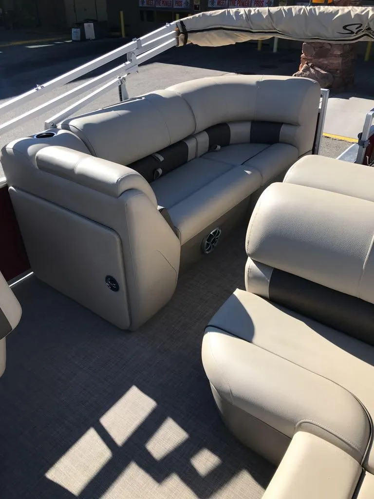 Slide: The Image of 2025 Sun Tracker Party Barge 22 RF XP3 interior seating, beige upholstery, spacious layout. - 11