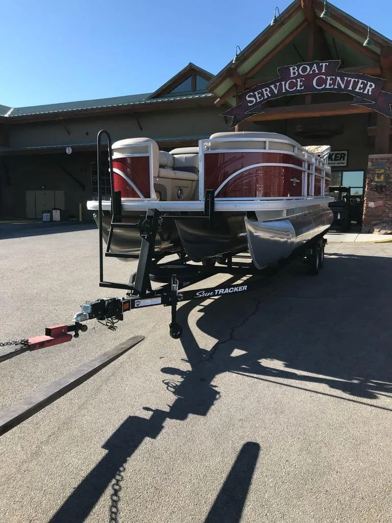 Slide: The Image of 2025 Sun Tracker Party Barge 22 RF XP3 at boat service center. - 2