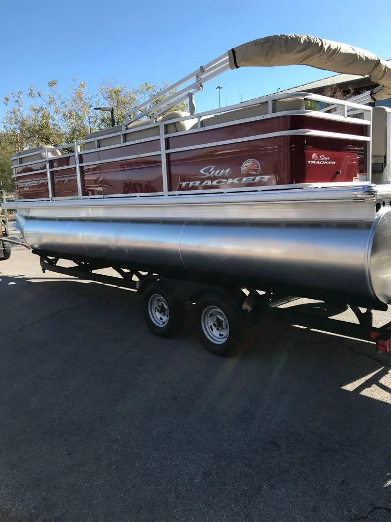 Slide: The Image of 2025 Sun Tracker Party Barge 22 RF XP3 pontoon boat on trailer. - 3