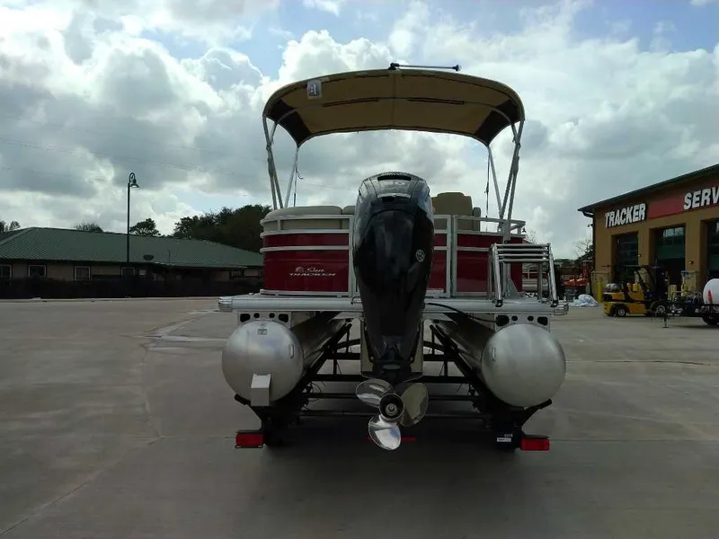 Slide: The Image of 2025 Sun Tracker Party Barge 20 DLX pontoon boat with canopy in parking lot. - 4