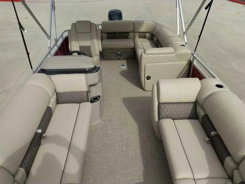 Slide: The Image of 2025 Sun Tracker Party Barge 20 DLX interior with beige seating and spacious layout. - 8