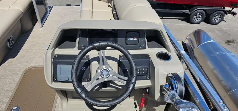 Slide: The Image of 2025 Sun Tracker Party Barge 22 RF XP3 steering console with modern controls and seating. - 10