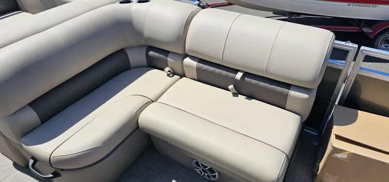 Slide: The Image of 2025 Sun Tracker Party Barge 22 RF XP3 beige seating area with cup holders. - 6