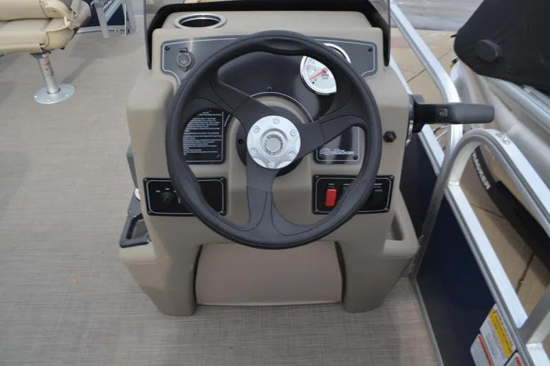 Slide: The Image of Steering console of 2025 Sun Tracker Party Barge 16 DLX pontoon boat. - 2