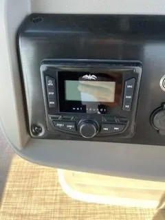 Slide: The Image of Control panel of 2025 Sun Tracker SportFish 20 DLX boat. - 7