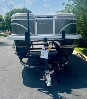 Slide: The Image of 2025 Sun Tracker Party Barge 22 RF DLX pontoon boat on trailer. - 2