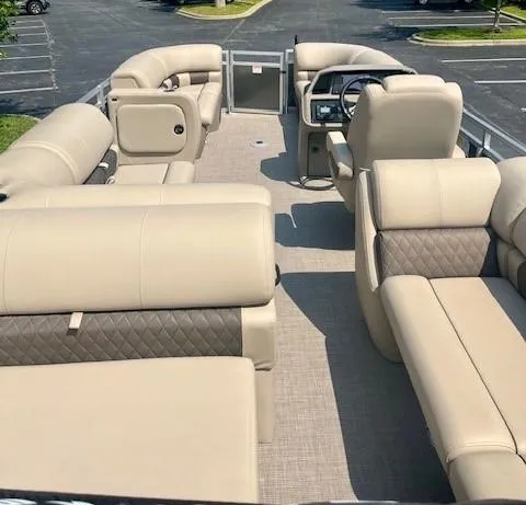 Slide: The Image of 2025 Sun Tracker Party Barge 22 RF DLX with spacious beige seating and modern design. - 3