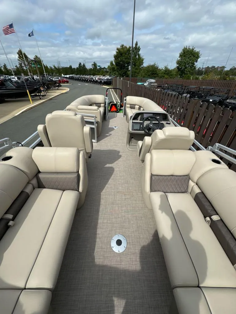 Slide: The Image of 2025 Sun Tracker Party Barge 22 DLX with spacious seating and modern design. - 2