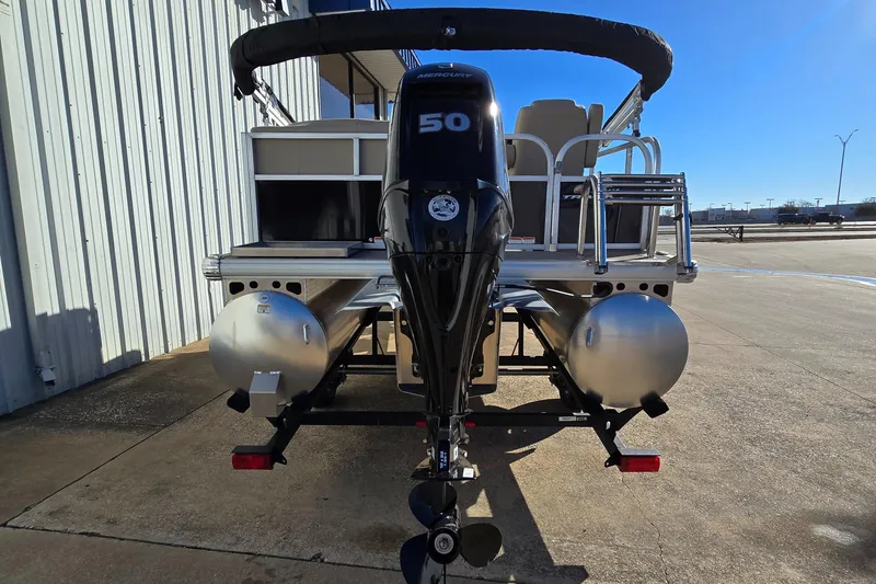 Slide: The Image of 2025 Sun Tracker Party Barge 16 DLX pontoon boat with 50 HP engine, rear view. - 3