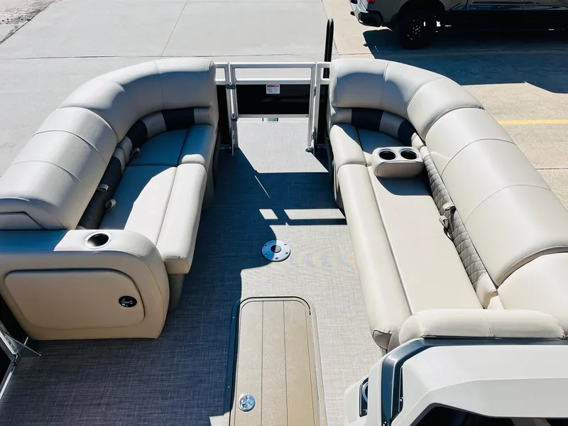 Slide: The Image of 2025 Sun Tracker SportFish 22 XP3 pontoon boat interior with spacious seating and cup holders. - 11