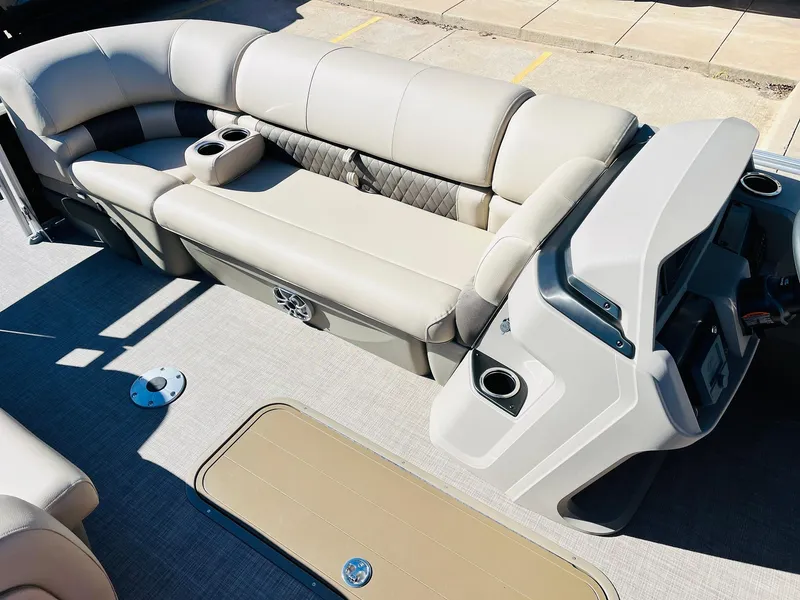 Slide: The Image of 2025 Sun Tracker SportFish 22 XP3 interior with beige seating and console. - 20