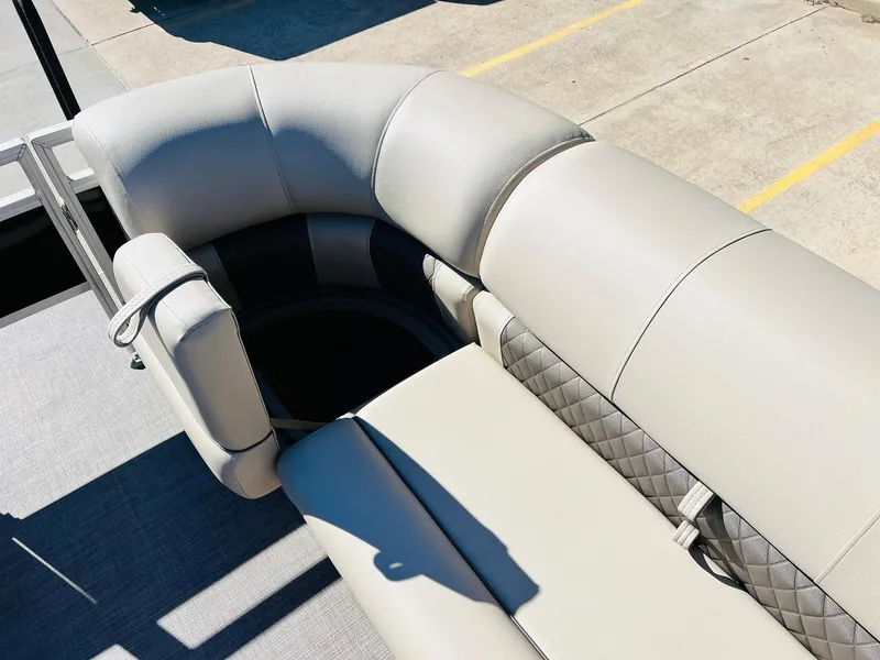 Slide: The Image of 2025 Sun Tracker SportFish 22 XP3 boat seating with gray upholstery and diamond-patterned accents. - 26