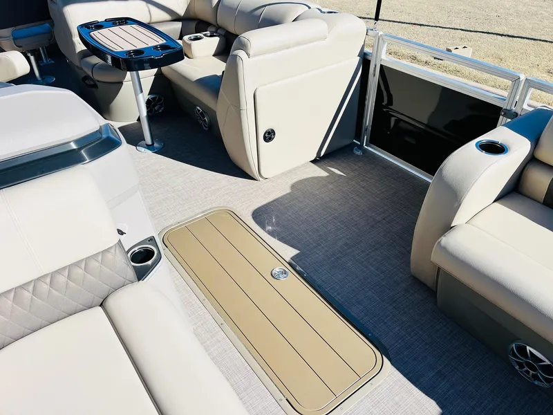 Slide: The Image of Luxurious interior of 2025 Sun Tracker SportFish 22 XP3 pontoon boat with plush seating. - 28