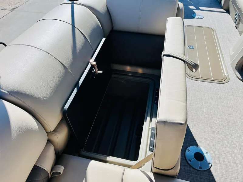 Slide: The Image of 2025 Sun Tracker SportFish 22 XP3 boat interior with open storage compartment. - 40