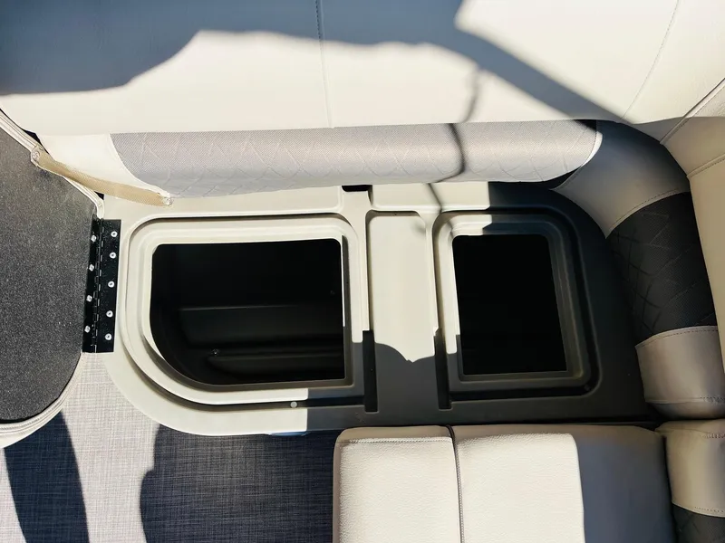 Slide: The Image of 2025 Sun Tracker SportFish 22 XP3 storage compartments, beige interior, open hatches. - 42